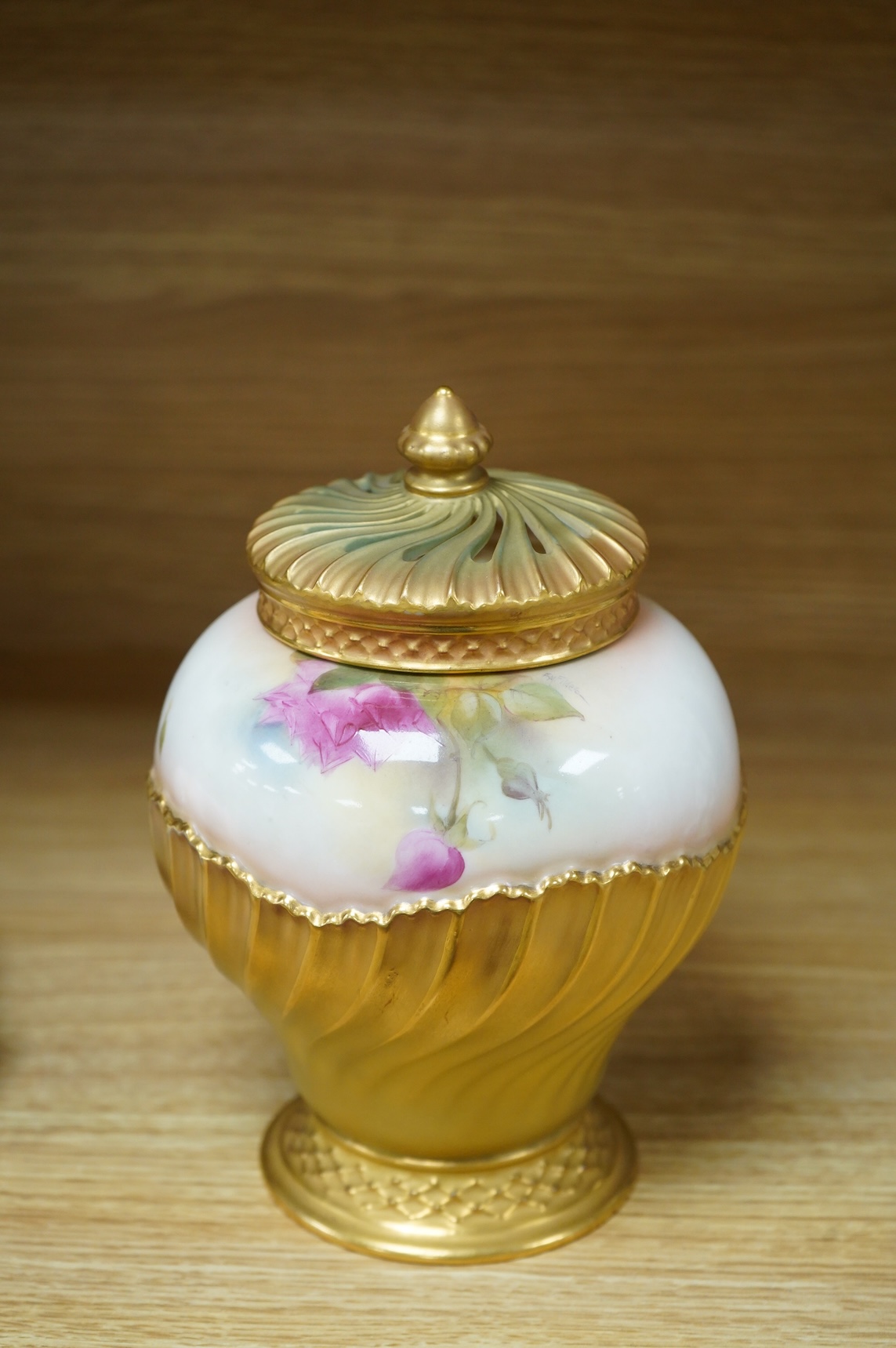 A Worcester pot pourri, cover and liner, signed E.M. Fildes, 20cm high